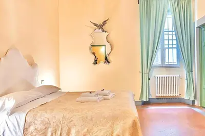 Letto o letti in una camera di The Santa Croce Palace By San Firenze Collection