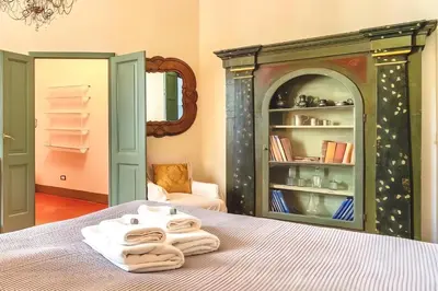 Letto o letti in una camera di The Santa Croce Palace By San Firenze Collection