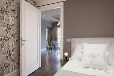 Letto o letti in una camera di UNYCA - Ponte Vecchio View Suite Florence