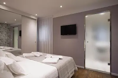 Letto o letti in una camera di UNYCA - Ponte Vecchio View Suite Florence