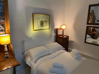 Letto o letti in una camera di Acacia Firenze - Anteo