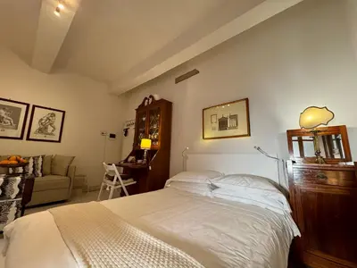 Letto o letti in una camera di Acacia Firenze - Anteo