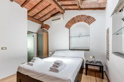Letto o letti in una camera di San Niccolò Tower Flat - Sweet Dreams in Florence