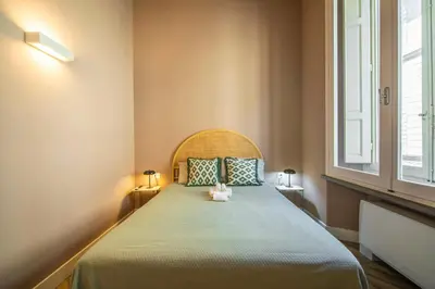 Letto o letti in una camera di Stylish Apartment on the Lungarno in Florence