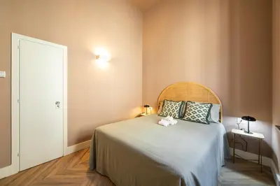 Letto o letti in una camera di Stylish Apartment on the Lungarno in Florence