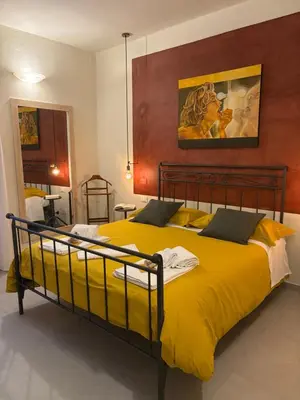 Letto o letti in una camera di Home 55 Firenze