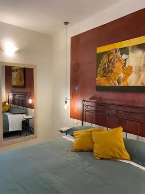 Letto o letti in una camera di Home 55 Firenze