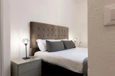 Letto o letti in una camera di Santo Spirito Living