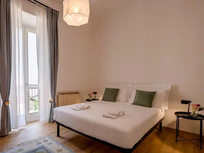 Letto o letti in una camera di Tuscan Tempo 2 Double Bedrooms Apt a stone's throw from the center