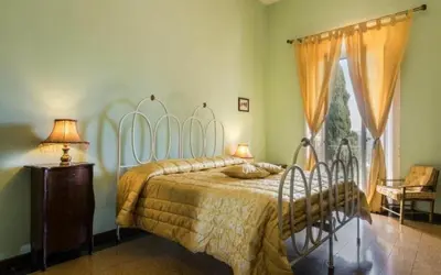 Letto o letti in una camera di Villa Del Mosaico
