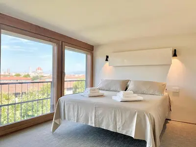 Letto o letti in una camera di Il Quadro sull'Arno