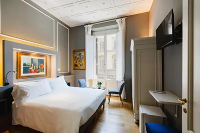 Letto o letti in una camera di AM Collection Cavour