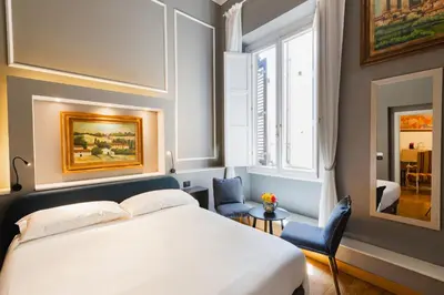 Letto o letti in una camera di AM Collection Cavour