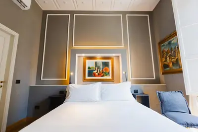 Letto o letti in una camera di AM Collection Cavour