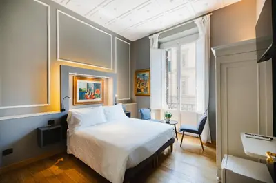 Letto o letti in una camera di AM Collection Cavour
