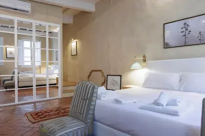 Letto o letti in una camera di Santo Spirito Suite