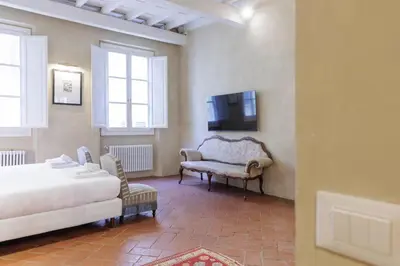 Letto o letti in una camera di Santo Spirito Suite