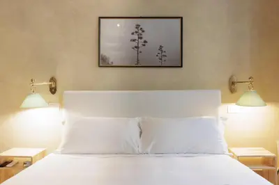 Letto o letti in una camera di Santo Spirito Suite