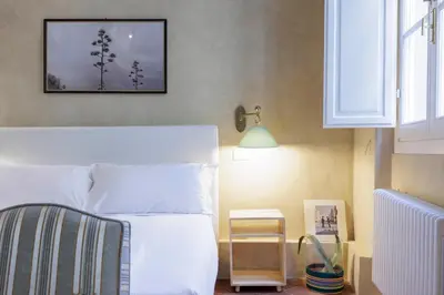 Letto o letti in una camera di Santo Spirito Suite