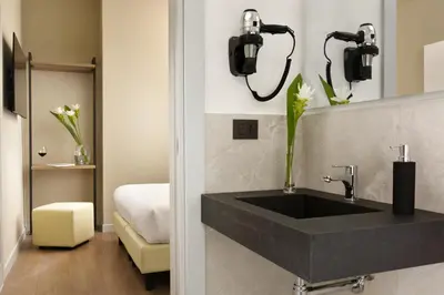 Letto o letti in una camera di Essence Hotel