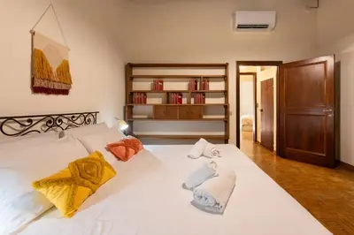 Letto o letti in una camera di Keys of Italy - Maggio 48 -family apartment nearby Pitti Palace