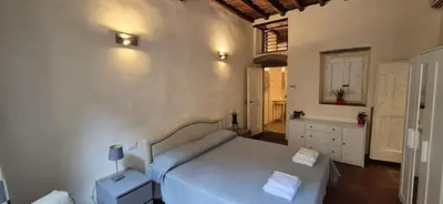 Letto o letti in una camera di Borgo San Frediano Hideaway