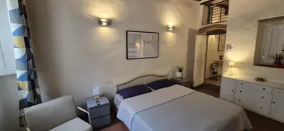 Letto o letti in una camera di Borgo San Frediano Hideaway