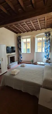 Letto o letti in una camera di Borgo San Frediano Hideaway