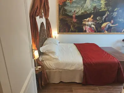 Letto o letti in una camera di Santa Caterina Palace Apartment in Florence-3 Bedroom