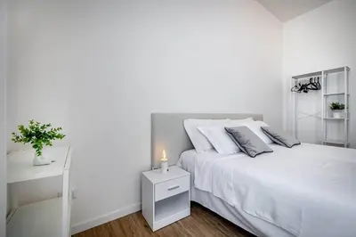 Letto o letti in una camera di YD Aleardi luminous and comfy