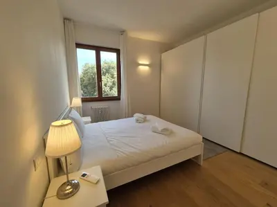Letto o letti in una camera di Appartamento Talenti con parcheggio