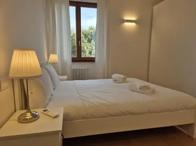 Letto o letti in una camera di Appartamento Talenti con parcheggio
