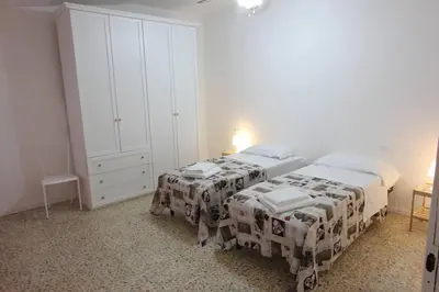 Letto o letti in una camera di Centro Storico