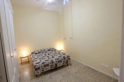 Letto o letti in una camera di Centro Storico