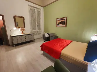 Letto o letti in una camera di Casa Lori - ai piedi di piazzale Michelangelo