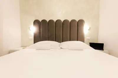 Letto o letti in una camera di MagicFlo Santa Croce Appartamento