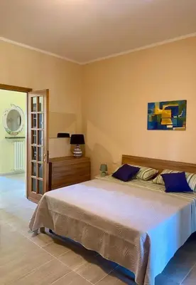 Letto o letti in una camera di Casa Margherita
