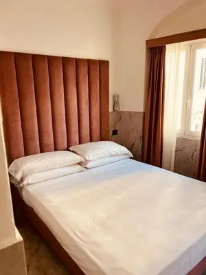 Letto o letti in una camera di Santa Margherita Firenze