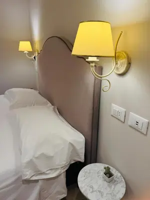 Letto o letti in una camera di La Boutique by Rjgal B&B