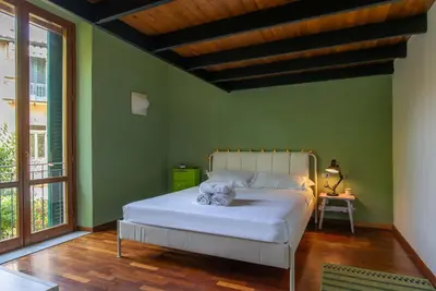 Letto o letti in una camera di Dimora 28 con Posto Auto Privato