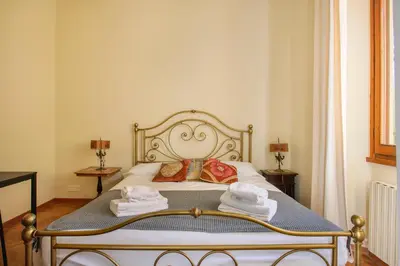 Letto o letti in una camera di Oltrarno Tasso Apartment in Florence