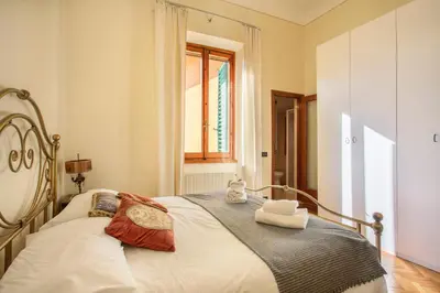 Letto o letti in una camera di Oltrarno Tasso Apartment in Florence