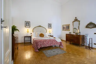 Letto o letti in una camera di Lungarno Prestige - Residenza Nobiliare