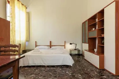 Letto o letti in una camera di Faenza Huge Apartment