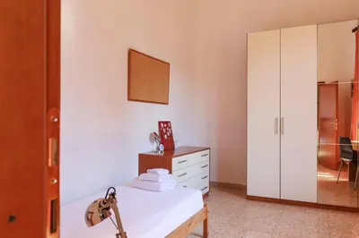 Letto o letti in una camera di Faenza Huge Apartment