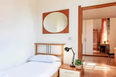 Letto o letti in una camera di Faenza Huge Apartment