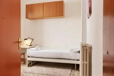 Letto o letti in una camera di Faenza Huge Apartment