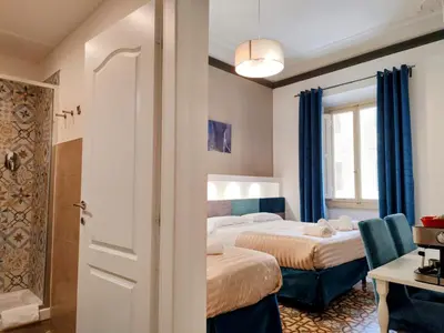 Letto o letti in una camera di Residenza San Lorenzo Firenze