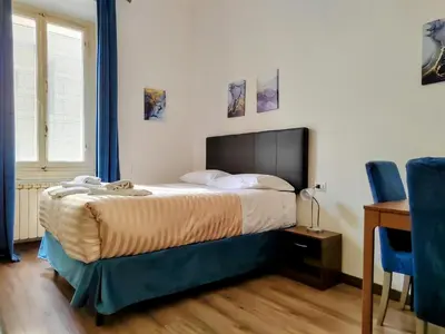 Letto o letti in una camera di Residenza San Lorenzo Firenze