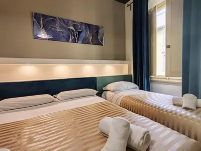 Letto o letti in una camera di Residenza San Lorenzo Firenze